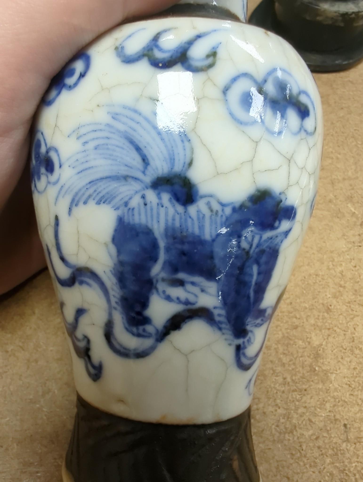 Three Chinese blue and white crackle glaze vases, a famille rose brush pot, late 19th/early 20th century, a crackle glaze ginger jar and a carved soapstone lion-dog (6)